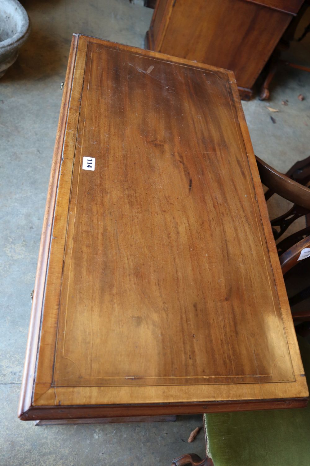 An Edwardian Georgian style mahogany chest with brushing slide and four graduated long drawers, on bracket feet, width 87cm